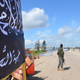 Members of al Qaeda’s Nusra Front man a checkpoint in Idlib.